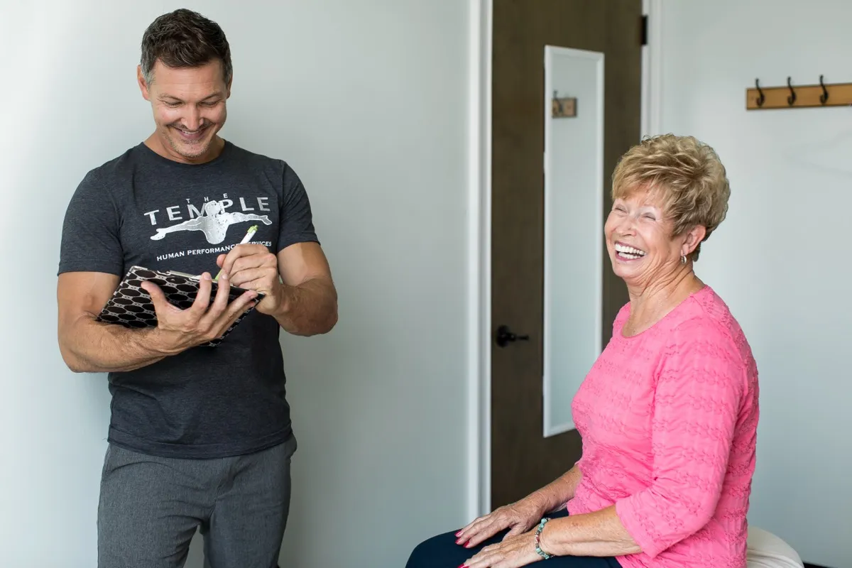A Temple therapist working with an older client on mobility and balance