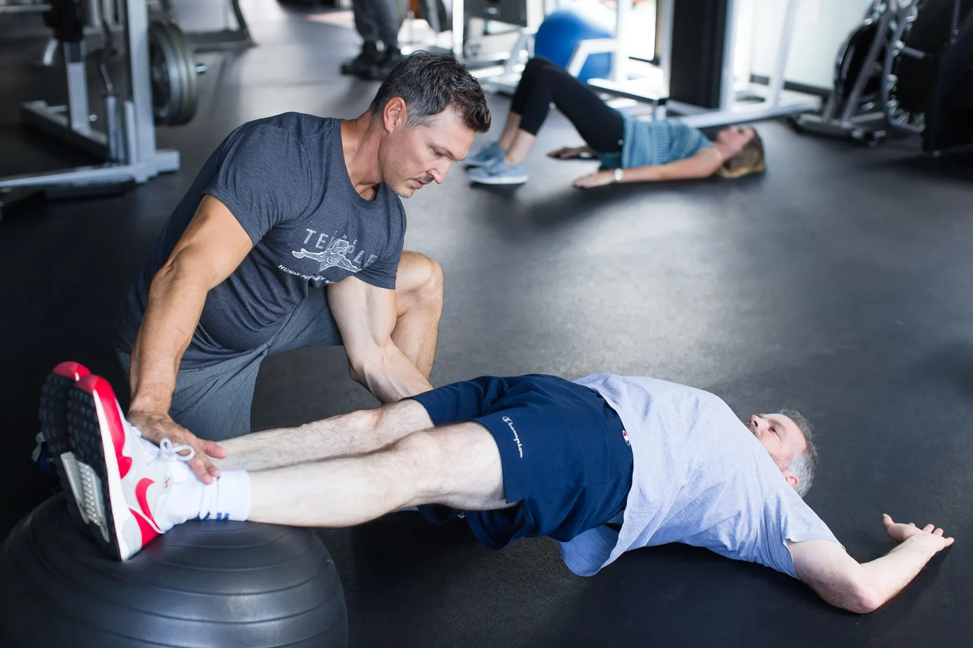 A Temple Human Performance therapist working hands-on with a client
